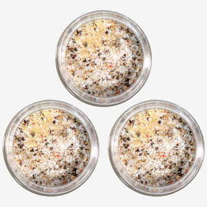 A top view of three open jars of Toomey's Seasoning.